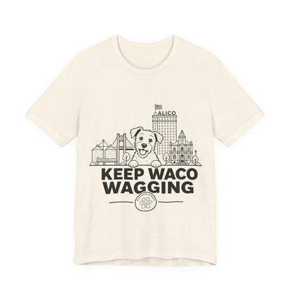 Keep Waco Wagging — Rescue Mutt and Waco skyline artwork on Natural tee