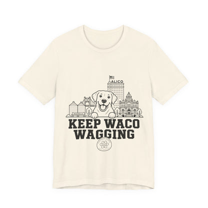 Keep Waco Wagging Labrador Edition — Labrador and Waco skyline artwork on Natural tee