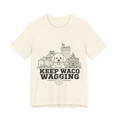 Keep Waco Wagging Maltipoo Edition — Maltipoo and Waco skyline artwork on Natural tee