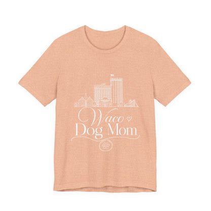 Waco Dog Mom Tee — dog mom Waco skyline artwork on Heather Peach tee