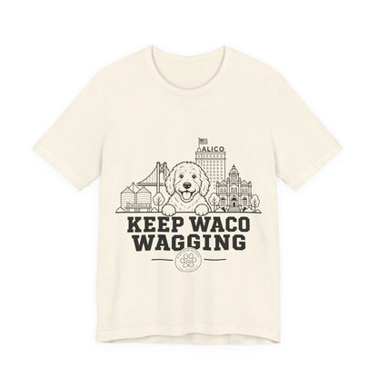 Keep Waco Wagging Doodle Edition — Doodle and Waco skyline artwork on Natural tee