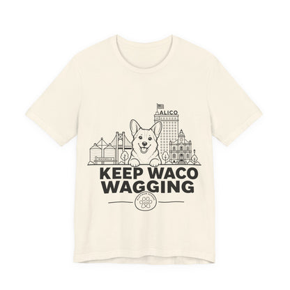 Keep Waco Wagging — Corgi and Waco skyline artwork on Natural tee