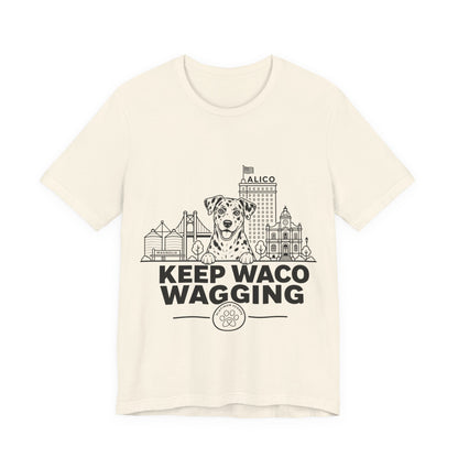 Keep Waco Wagging — Catahoula and Waco skyline artwork on Natural tee