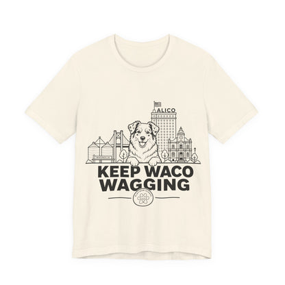 Keep Waco Wagging — Australian Shepherd and Waco skyline artwork on Natural tee